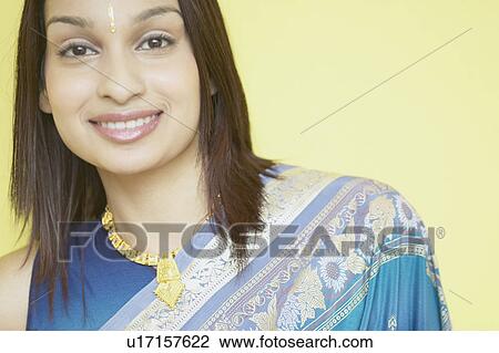 Portrait of a young woman smiling View Large Photo Image Stock Image - Portrait of a young woman smiling. Fotosearch