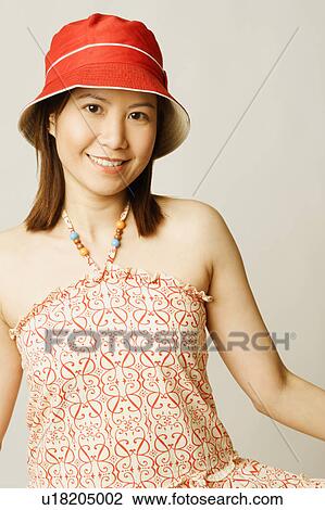 Portrait of a young woman smiling View Large Photo Image Stock Image - Portrait of a young woman smiling. Fotosearch