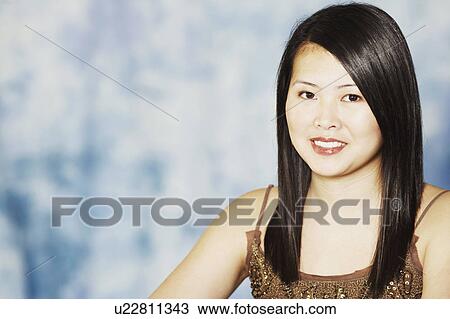 Portrait of a young woman smiling View Large Photo Image Stock Image - Portrait of a young woman smiling. Fotosearch