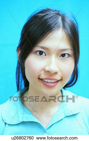 Portrait of a young woman smiling View Large Photo Image Stock Image - Portrait of a young woman smiling. Fotosearch
