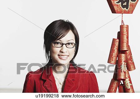 Portrait of a young woman smiling View Large Photo Image Stock Photo - Portrait of a young woman smiling. Fotosearch