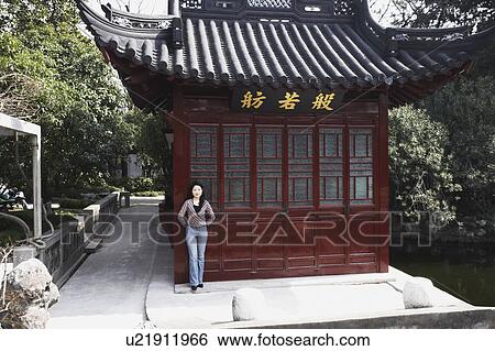 Stock Photograph - Portrait of a young woman smiling. Fotosearch