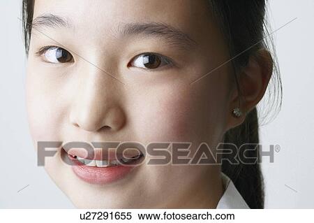 Portrait of a young woman smiling View Large Photo Image Stock Photography - Portrait of a young woman smiling. Fotosearch