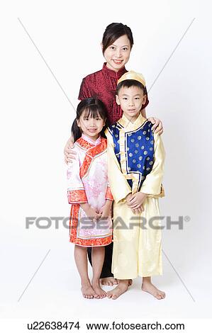 Picture - Portrait of a young woman standing with her children. Fotosearch