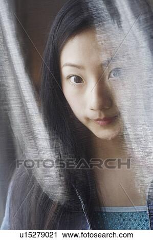 Stock Image - Portrait of a young woman. Fotosearch