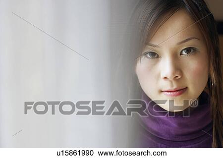 Stock Image - Portrait of a young woman. Fotosearch