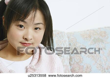 Portrait of a young woman View Large Photo Image Stock Photo - Portrait of a young woman. Fotosearch