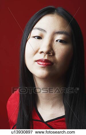 Stock Photo - Portrait of a young woman thinking. Fotosearch