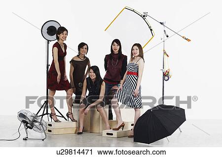 Stock Image - Portrait of five young women smiling. Fotosearch