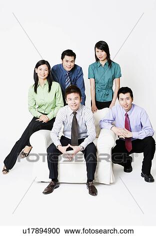 Portrait of three businessmen with two businesswomen smiling View Large Photo Image Stock Image - Portrait of three businessmen with two businesswomen smiling. Fotosearch