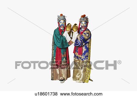 Stock Photo - Portrait of two male Chinese opera performers holding bowls full of gold coins. Fotosearch