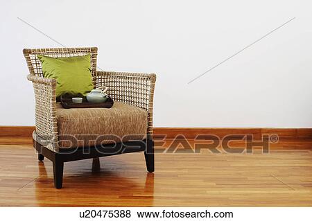 Teapot and a tea cup with a tray in an armchair View Large Photo Image Stock Photo - Teapot and a tea cup with a tray in an armchair. Fotosearch