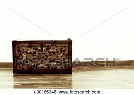 Trunk on a hardwood floor View Large Photo Image Stock Photo - Trunk on a hardwood floor. Fotosearch