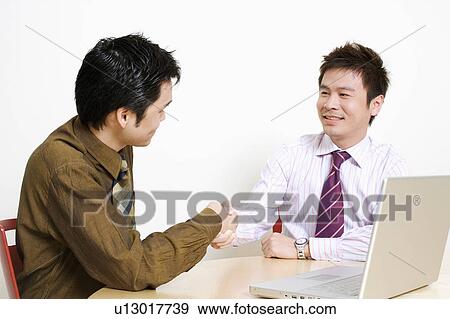 Two businessmen shaking hands View Large Photo Image Stock Photo - Two businessmen shaking hands. Fotosearch