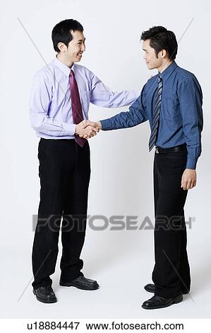 Two businessmen shaking hands View Large Photo Image Stock Photo - Two businessmen shaking hands. Fotosearch