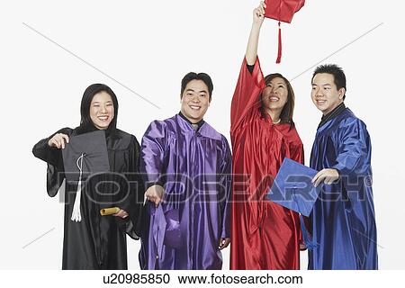 Two male graduates and two female graduates holding their mortar boards View Large Photo Image Stock Image - Two male graduates and two female graduates holding their mortar boards. Fotosearch