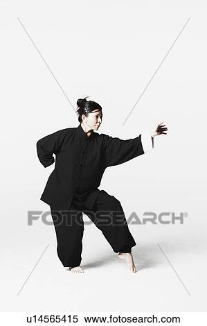 Young woman practicing martial arts View Large Photo Image Stock Photography - Young woman practicing martial arts. Fotosearch