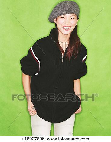 Young woman wearing a beret and smiling View Large Photo Image Stock Photograph - Young woman wearing a beret and smiling. Fotosearch
