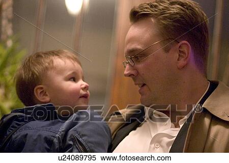 Stock Photography - Father speaking directly to son. Fotosearch