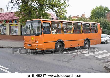 Stock Photo - Orange tour bus. Rawa Mazowiecka Central Poland. Fotosearch