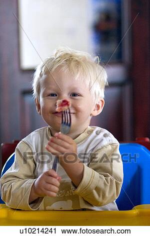 Polish toddler eating dumpling View Large Photo Image Stock Image - Polish toddler eating dumpling. Fotosearch