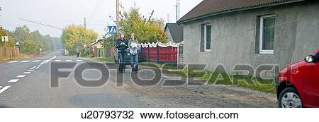 Teens walking along road. Highway 72 between Lodz and Rawa Maz. Central Poland View Large Photo Image Stock Image - Teens walking along road. Highway 72 between Lodz and Rawa Maz. Central Poland. Fotosearch