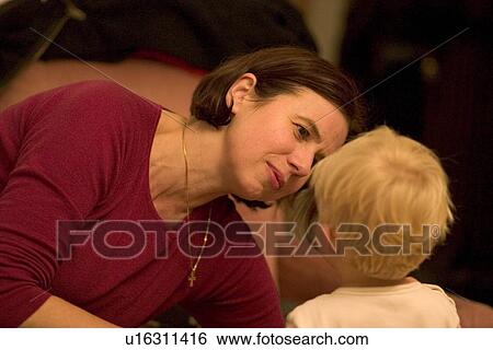 Toddler talking to adult friend View Large Photo Image Stock Photograph - Toddler talking to adult friend. Fotosearch
