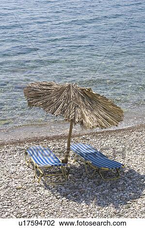 Stock Image - Beach, Ocean, Relaxing Chair. Fotosearch