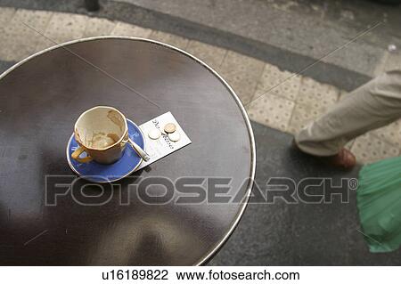 Stock Image - beverage, saucer, spoon, outdoor, cafe, detail. Fotosearch