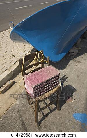 Stock Image - Blue, Boat, Chair, Close-Up, Concrete Block. Fotosearch