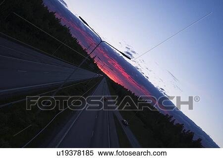 Stock Photography - Blue Sky, Dawn, Clouds, Car, Automobile. Fotosearch