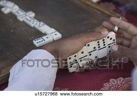 Stock Photo - Board Game, Domino, Close-Up, Cigarette, Adults Only. Fotosearch