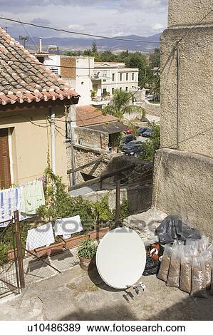 Stock Photo - Building Exterior, Building Structure, Car, Clothesline, Clothing. Fotosearch