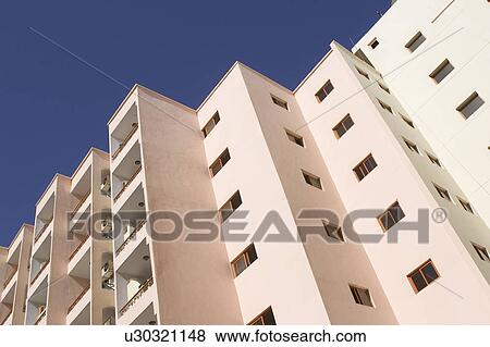 Stock Photo - Building Exterior, Day, Clear Sky, Building Structure, Apartment. Fotosearch