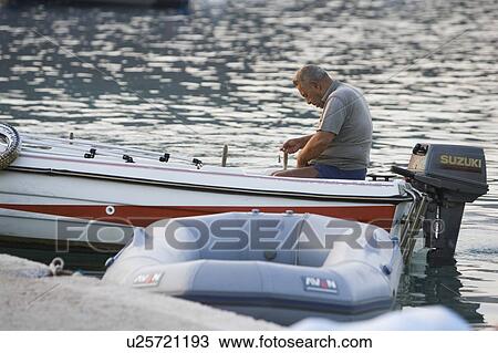Stock Image - Casual Clothing, Day, Dock, Floating On Water. Fotosearch