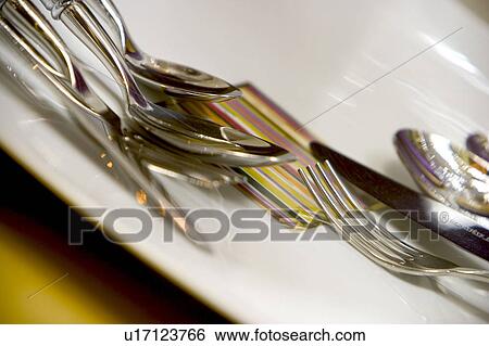 Stock Photograph - dinner ware, glassware, silver, silverware, polished, shine. Fotosearch