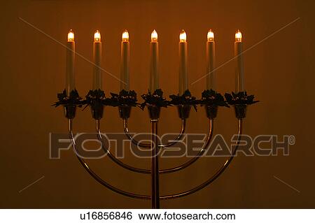 Stock Photograph - indoors, light, lighting, lit, flame. Fotosearch