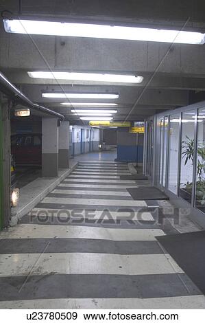 Stock Photo - wall, shadows, enclosed, path, subway, parking. Fotosearch