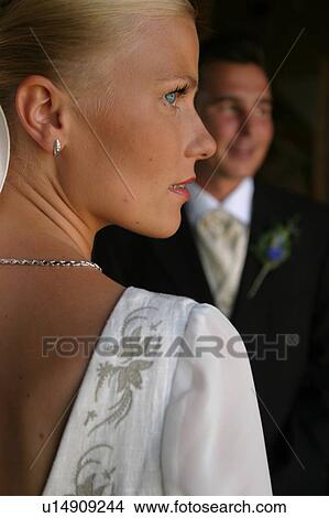 Picture - woman, couple, standing, gown, formal. Fotosearch
