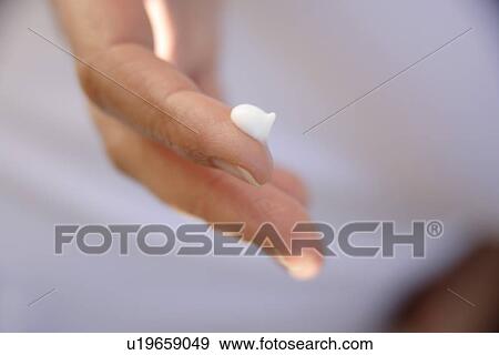 Bit of moisturizing creme on fingertip, close up View Large Photo Image Stock Photo - Bit of moisturizing creme on fingertip, close up. Fotosearch