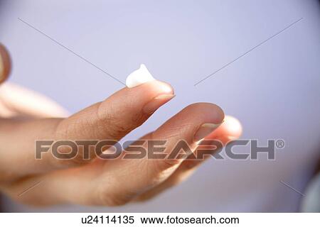 Bit of moisturizing creme on fingertip, close up View Large Photo Image Stock Photography - Bit of moisturizing creme on fingertip, close up. Fotosearch