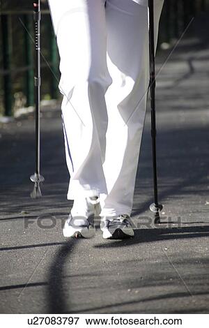 Stock Photo - Female Nordic Walker, close up of legs. Fotosearch