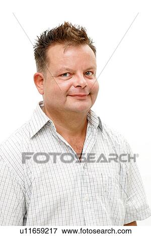 Stock Photo - Overweight man smiling, portrait. Fotosearch