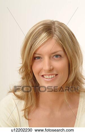 Stock Image - Portrait of woman, smiling. Fotosearch