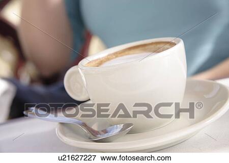 Woman drinking cup of cappuccino View Large Photo Image Stock Photo - Woman drinking cup of cappuccino. Fotosearch