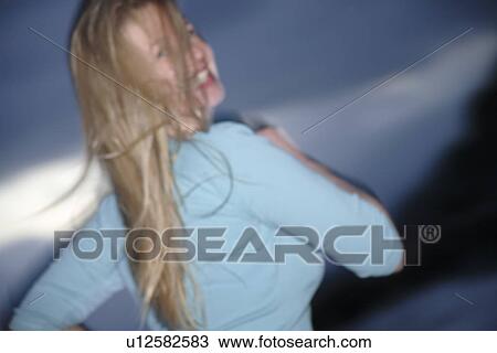Young blond woman jogging at the beach, side view View Large Photo Image Stock Image - Young blond woman jogging at the beach, side view. Fotosearch
