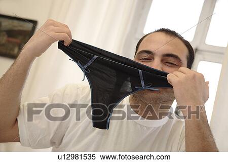 Young man proudly showing his underpants View Large Photo Image Stock Photography - Young man proudly showing his underpants. Fotosearch