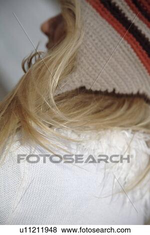Young woman wearing knitted cap, side view, close up View Large Photo Image Stock Photo - Young woman wearing knitted cap, side view, close up. Fotosearch