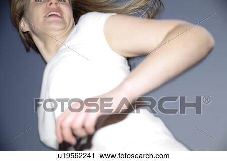 Young woman with long blond hair running at the beach, worm's eye view View Large Photo Image Stock Image - Young woman with long blond hair running at the beach, worm's eye view. Fotosearch