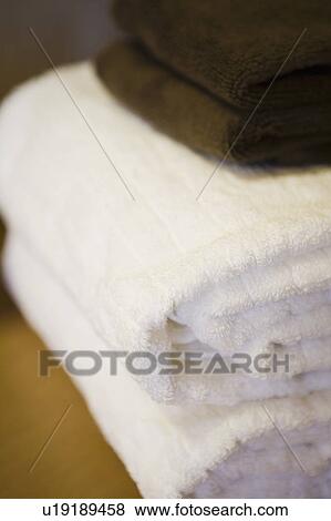 Stock Photo - Clean Folded Towels on Bathroom Counter. Fotosearch